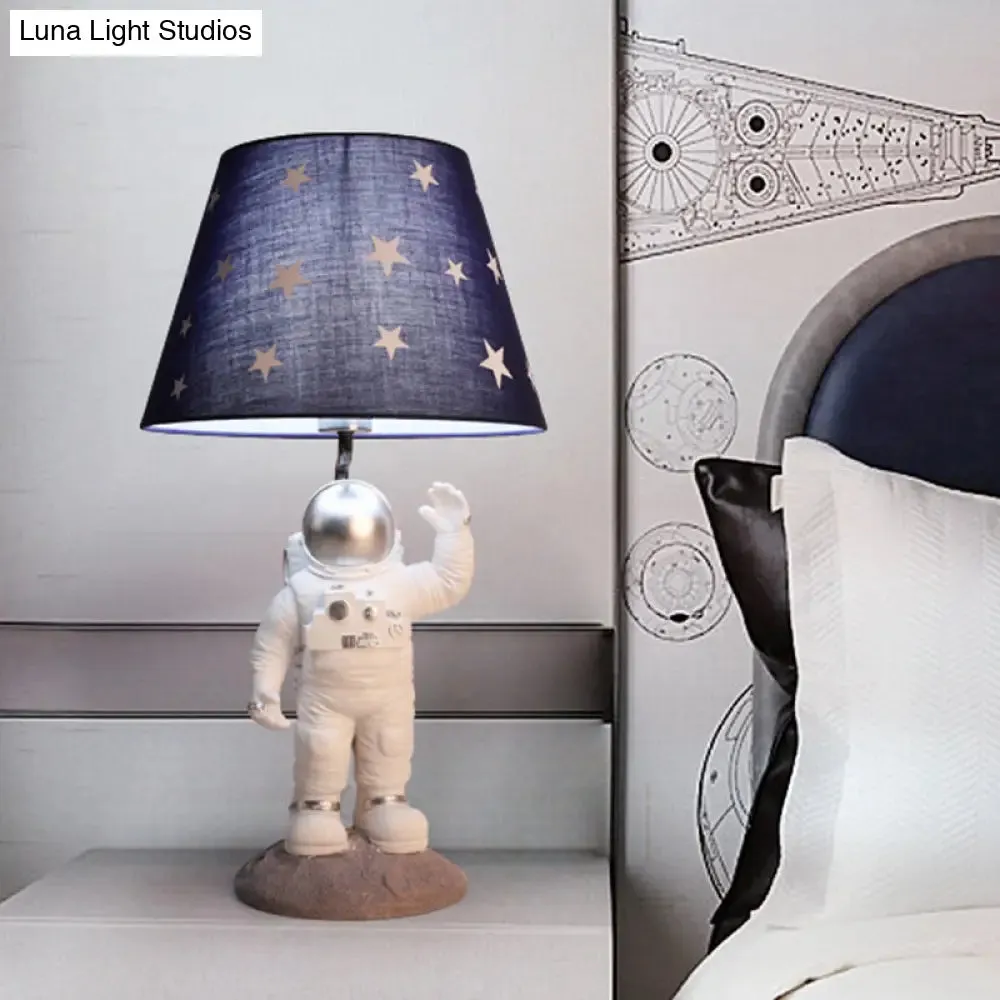 Cartoon Astronaut Table Lamp with Star Patterned Fabric Shade - Perfect Nightstand Lighting for Kids