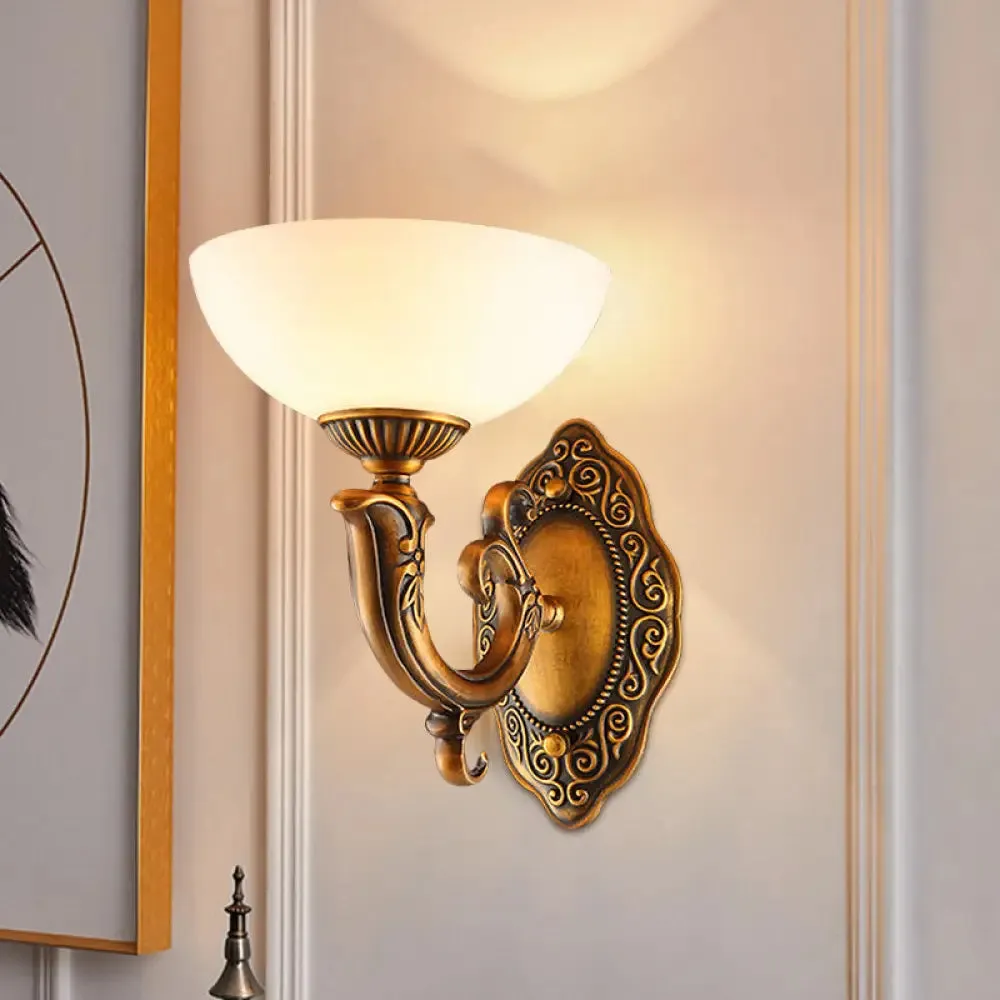 Rustic Brass Wall Sconce with Frosted Glass Shade - Swooping Arm Design for Ambient Lighting