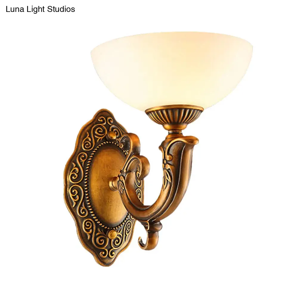 Rustic Brass Wall Sconce with Frosted Glass Shade - Swooping Arm Design for Ambient Lighting